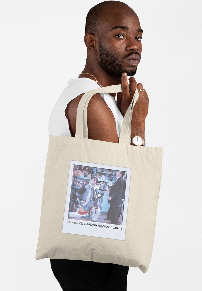 Beżowa torba tote z płótna z obrazkiem w ramce i napisem, mocnymi uchwytami i gładką teksturą. Idealna na co dzień.