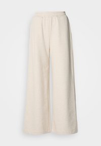 Ψηλόμεσες, φαρδιές παντελόνες από ανοιχτό μπεζ ύφασμα. Διαθέτουν ελαστική μέση και πλαϊνές τσέπες. Μαλακή υφή με χαλαρό σχέδιο.