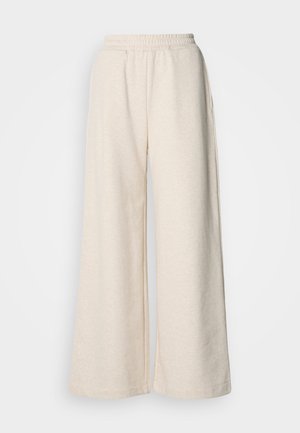 Højtsiddende, vide bukser i lysebeige stof. Har en elastisk talje og sidelommer. Blød tekstur med et afslappet design.