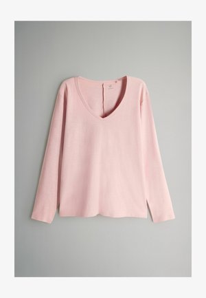 Top a maniche lunghe rosa chiaro con scollo a V, realizzato in tessuto morbido, con una vestibilità rilassata e spacco laterale all'orlo per un maggiore movimento.
