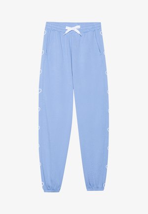 Lichtblauwe joggers van zachte stof met een witte trekkoord, zijzakken en witte hartvormige accenten langs de naden.
