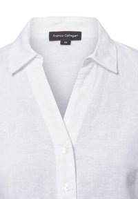 White linen shirt with a collared neckline, featuring a button closure and a label that reads “Franco Callegari” with size 36.