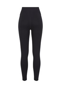 Sorte højtaljede ribstrikkede leggings set bagfra, med sømløst design og ankellængde.