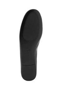 Suola di scarpa in gomma nera con superficie liscia e grip texture. Bordo curvo e leggero tacco sul retro, progettato per il comfort.