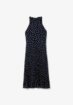 Abito midi nero senza maniche con pois bianchi, collo alto e dettaglio di gonna plissettata.