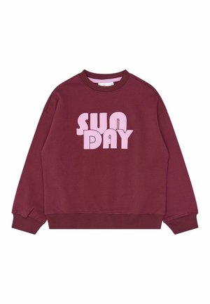 Sweat-shirt bordeaux à manches longues avec poignets et bas côtelés, avec un grand texte rose « SUNDAY » en police épaissie et stylisée à l'avant.
