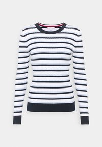 Maglione a maniche lunghe bianco a costine con strisce orizzontali nere, polsini neri, orlo e colletto.