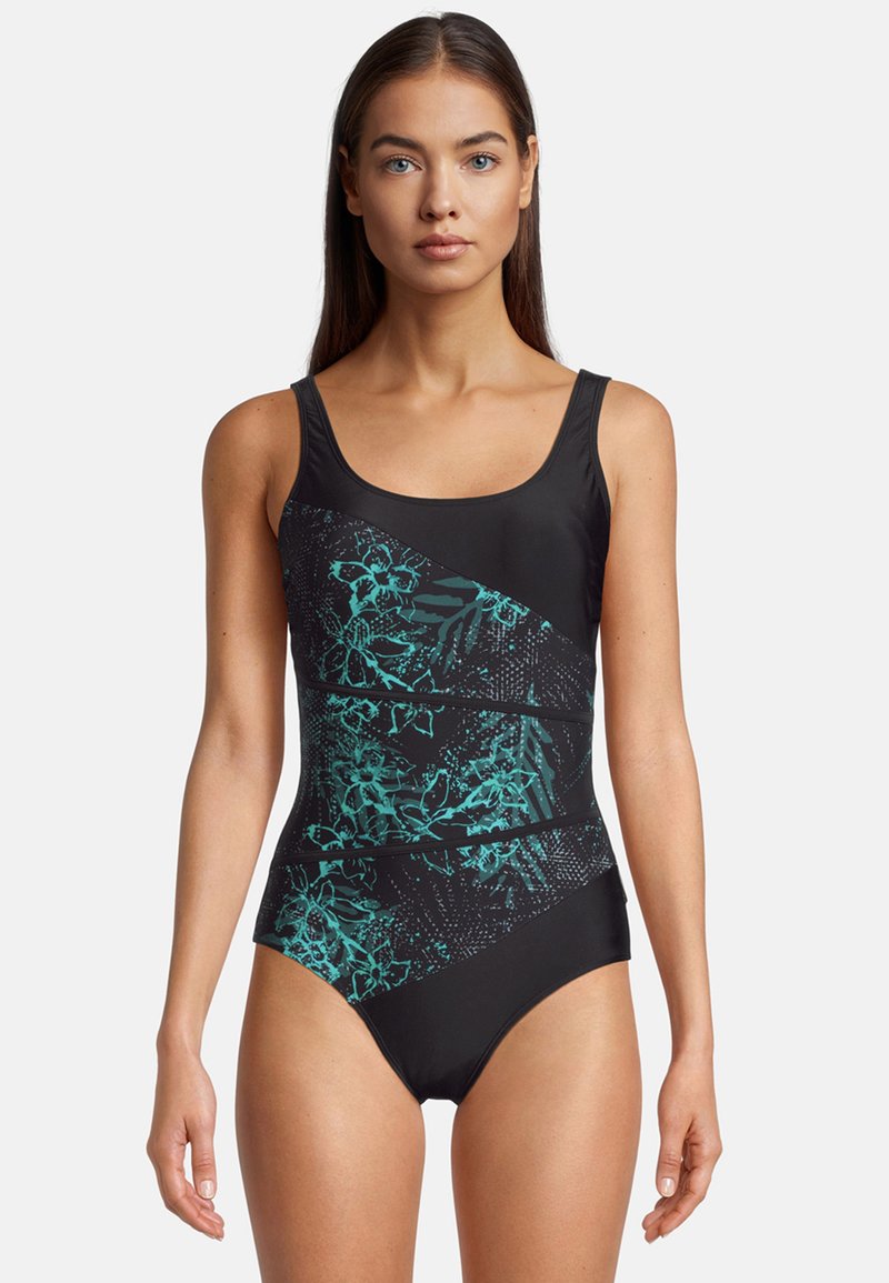 Maillot de bain noir avec des motifs botaniques teal, présentant un décolleté arrondi et des bretelles réglables. Tissu lisse et extensible pour le confort.