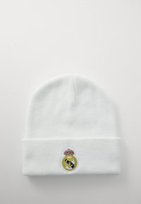 White knit beanie featuring a fold-over cuff. Embroidered Real Madrid logo in yellow, blue, and a crown detail on the front.