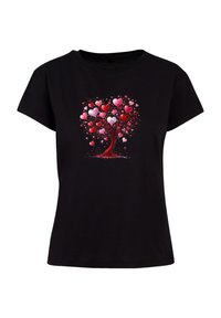 Black t-shirt featuring a graphic of a tree made of pink and red hearts, with a round neckline and short sleeves. Soft cotton material.