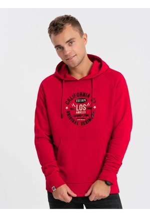 Rode hoodie met een voorzak, een trekkoordkap en geribbelde manchetten. Heeft een grafische print met tekst en sterren in zwart-wit.