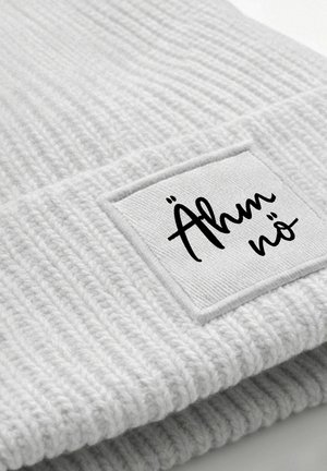 Light gray ribbed beanie with a soft texture and a square white patch displaying the text "Ähm nö" in black cursive font.