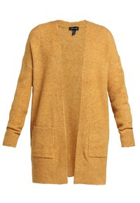 Keltainen neuletakki, jossa on tekstuuri, avoin edusta, kaksi etutaskua ja resorit hihansuuissa. Rentoon tyyliin sopiva laskostetuilla olkapäillä.