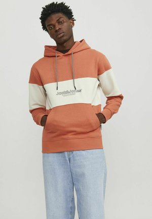 Kapuzenpullover mit einem Color-Block-Design in Terrakotta und Creme, ausgestattet mit einem Logo, Kordelzügen und gerippten Bündchen. Baumwollmischgewebe.