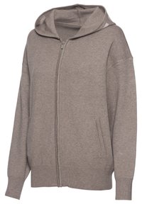Helle braune Zip-Hoodie aus weichem Stoff. Verfügt über eine Kapuze, zwei Seitentaschen und gerippte Bündchen sowie einen Saum. Einfaches, lässiges Design.