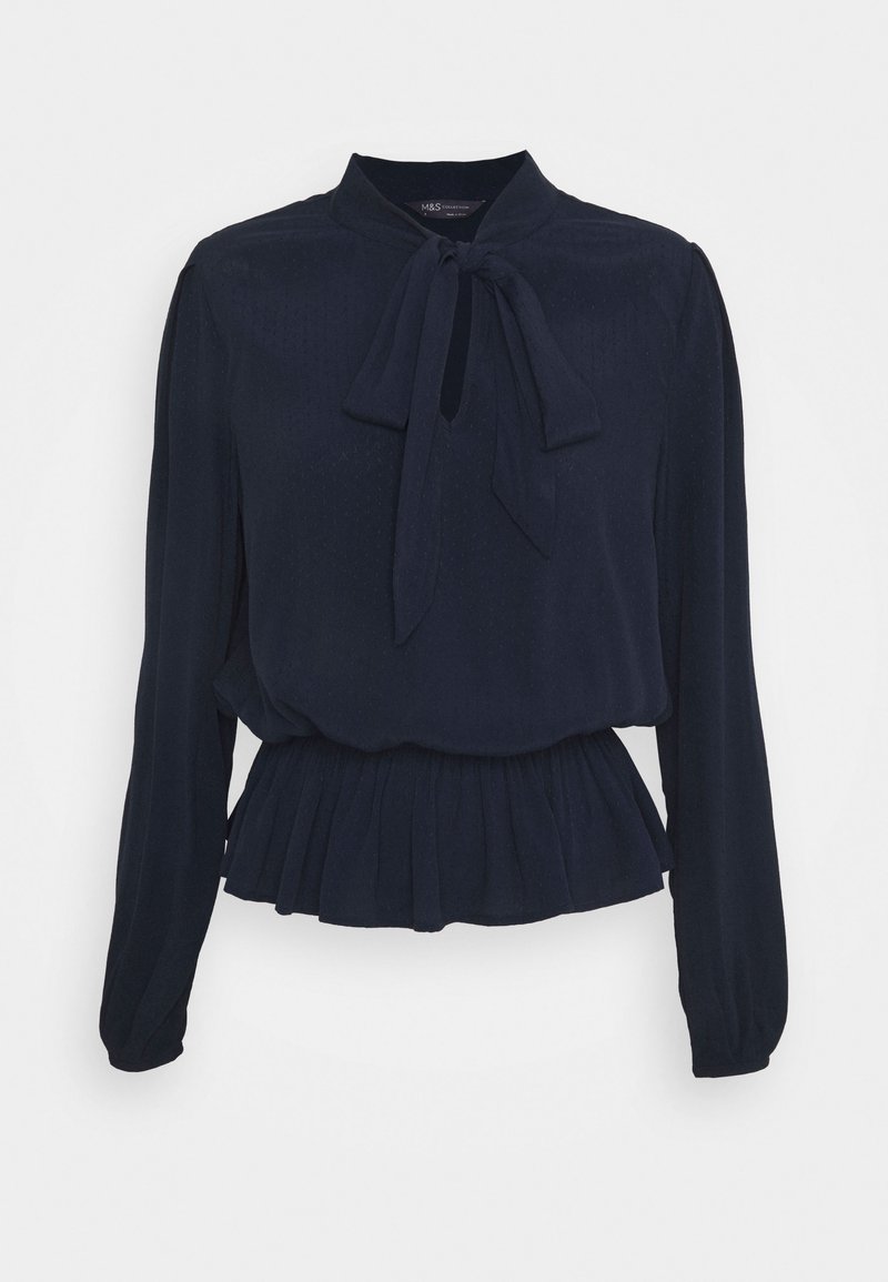 Blouse bleu marine à manches longues avec un col noué en forme de nœud et une taille ajustée plissée.