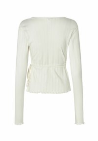 Biely pruhovaný top s dlhým rukávom a peplum pásom, so zaväzovaním na chrbte a volánovým lemom. Mäkko pletená štruktúra.