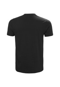 Camiseta negra de manga corta hecha de algodón. Presenta un cuello redondo y la parte de atrás lisa, sin patrones ni detalles visibles.