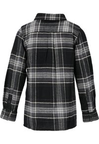 Chemise en flanelle à carreaux noirs et gris avec des manches longues, des poignets boutonnés et un détail de empiècement au dos. Texture douce avec un motif de carreaux marqué.