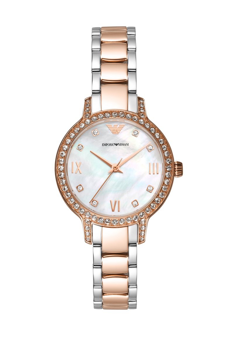 Gold and silver metal watch with a round white mother-of-pearl dial, rose gold accents, and a crystal-studded bezel. Roman numeral markers.