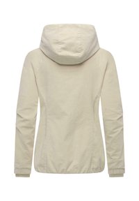 Lichtbeige jas met capuchon, ritssluiting en elastische manchetten. Heeft een aangesloten ontwerp en een gladde katoenen stoftextuur.