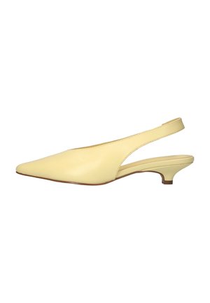 Pale yellow leather slingback shoe with pointed toe and low kitten heel on white background.