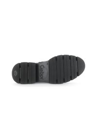 Black rubber shoe sole with ridged texture and circular pattern. Features the "Gabor" logo centrally placed and a circular tread design.