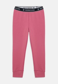 Leggings thermiques pour enfants en rose avec une taille élastique noire, présentant le logo Didriksons répété, des coutures à plat et des chevilles resserrées.