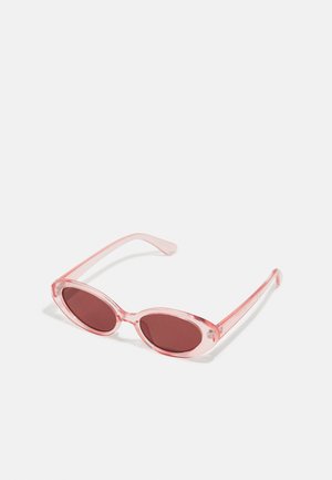 Pink transparent sunglasses with oval lenses, dark red tint, and slender arms, featuring a smooth finish and subtle detailing on the frame.