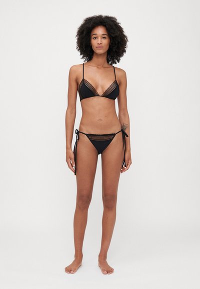 Black bikini set featuring a triangular top with lace trim and adjustable straps, paired with side-tie bikini bottoms. Smooth texture.