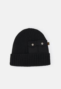 Black knitted beanie with ribbed texture, featuring a flat panel with two snap-button pockets on the side.