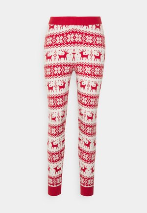 Red and white patterned leggings with a festive design featuring reindeer and snowflakes. Knitted fabric with a fitted silhouette and red waistband.
