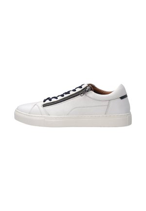 White leather sneaker with navy laces and side zipper detail. Features a textured surface and a flat rubber sole. Minimalist design.