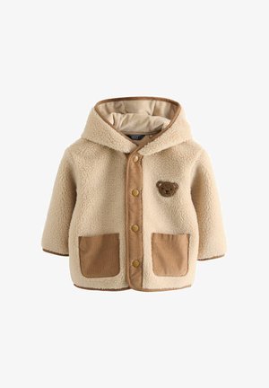 Giacca in pile teddy beige con un pannello anteriore in corduroy marrone, due tasche frontali, un cappuccio e una toppa a forma di orso sul petto.