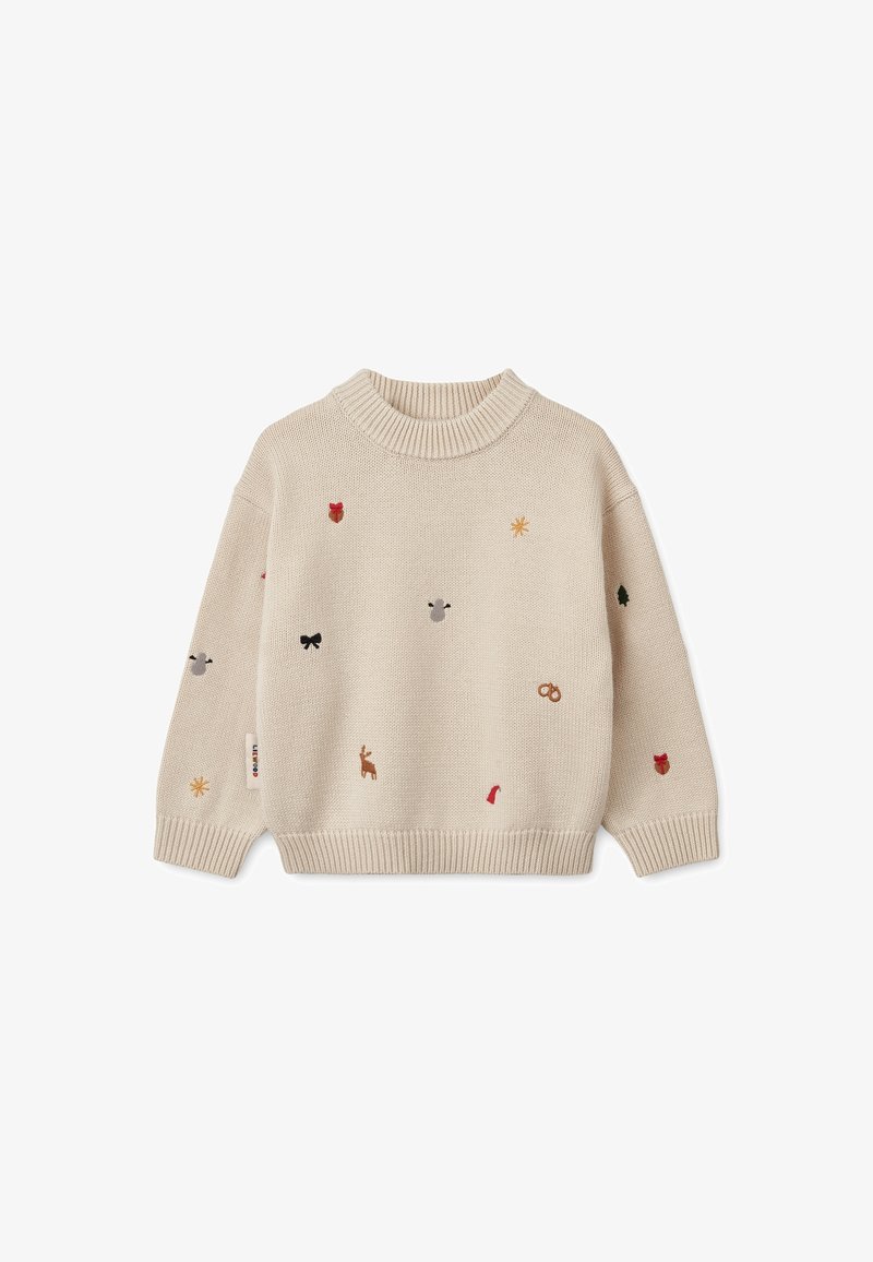 Pull en maille beige avec petits motifs brodés de fête, incluant un renne, un nœud rouge, une étoile, des feuilles et des glands, manches longues et poignets côtelés.