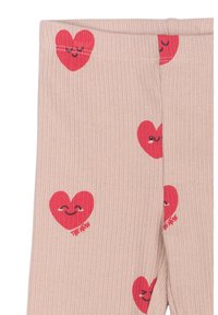 Beige bordázott leggings, melyeken szórtan vörös szív minták találhatók arckifejezésekkel. Rugalmas derékpánt a kényelemért. Puha textúra.