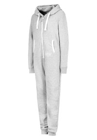 Gray zip-up onesie made of soft fabric with a hood, white drawstrings, and side pockets. Features ribbed cuffs and simple logo detail.