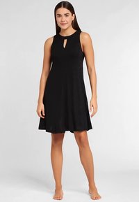 Schwarzes ärmelloses Kleid mit rundem Ausschnitt und Schlüsselloch-Detail. Ausgestellte Silhouette, die über dem Knie endet, gefertigt aus glattem Stoff.