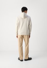 BOSS SAGGY - Majica s kapuljačom i patentnim zatvaračem - light beige