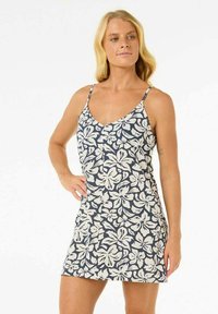 Blumendruckkleid in Marineblau und Creme. Mit dünnen Trägern, einem V-Ausschnitt und einer lockeren Passform, die bis zur Mitte des Oberschenkels reicht und eine glatte Textur zeigt.