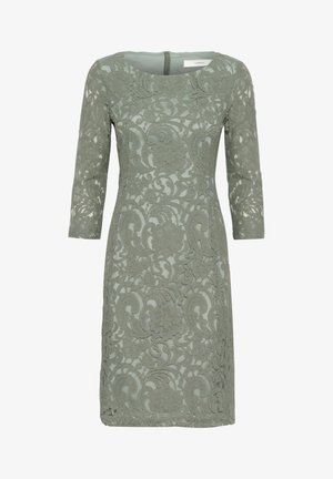 Spetsklänning i dämpad grön med ett blommönster, trekvartslånga ärmar, rak passform och rund halsringning. Dragkedja i ryggen.