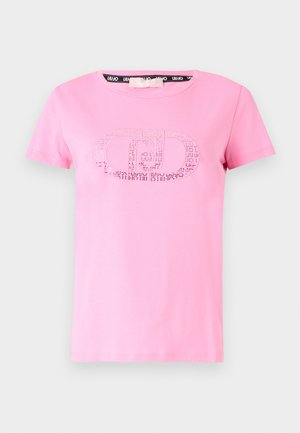 Maglietta di cotone rosa con maniche corte, scollatura rotonda e un logo decorativo argentato con punti e linee sul davanti.