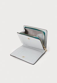 White pebbled leather wallet with gold hardware, featuring a zippered compartment, card slots, and a snap closure. Interior is lined in grey.