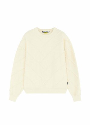 Maglione color avorio con scollo rotondo, motivo a chevron trapuntato, maniche lunghe, polsini a costine e piccolo etichetta laterale nera.