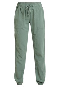 Pantalon ample vert clair en tissu doux et texturé, doté d'une taille élastique, d'un cordon de serrage et de poignets élastiques.
