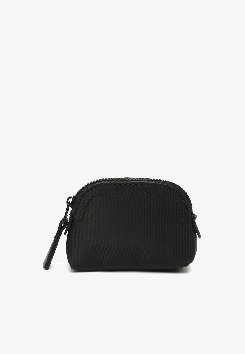 Black zippered pouch made of smooth material, oval shape, featuring subtle stitching detail and a small loop for attachment.