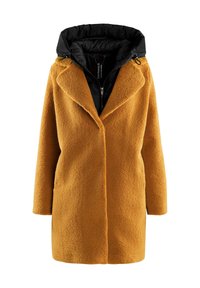 Sennepsgul tekstureret frakke med sort dunhette, oversized revers og lynlås foran. Lange ærmer og en afslappet silhuet.