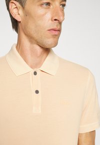 BOSS Polo - light/pastel orange