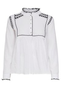 Camicia bianca con colletto alto a balze, dettagli ricamati neri, chiusura con bottoni frontali e maniche lunghe con polsini ondulati.