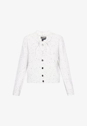 White knitted cardigan with black speckles, round neckline, long sleeves, six black buttons down the front, and a bow detail at the collar.